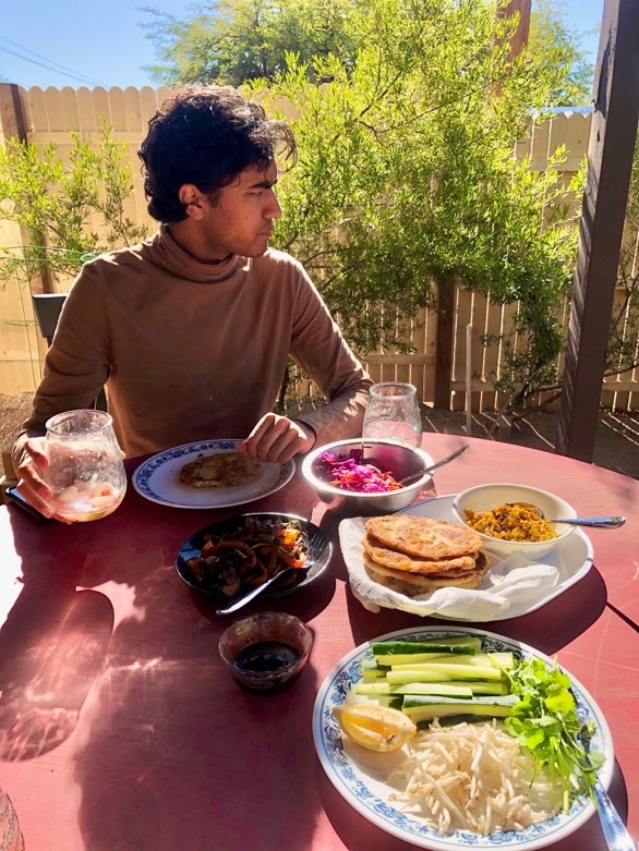 Figure 2. Photograph of Kunal eating a meal in Tucson, AZ.